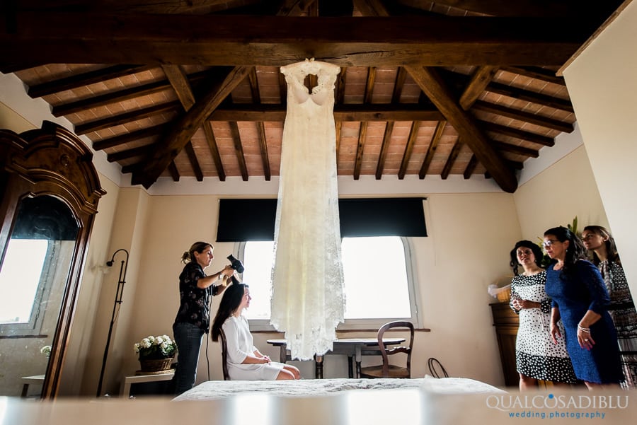 bride getting ready room wedding dress