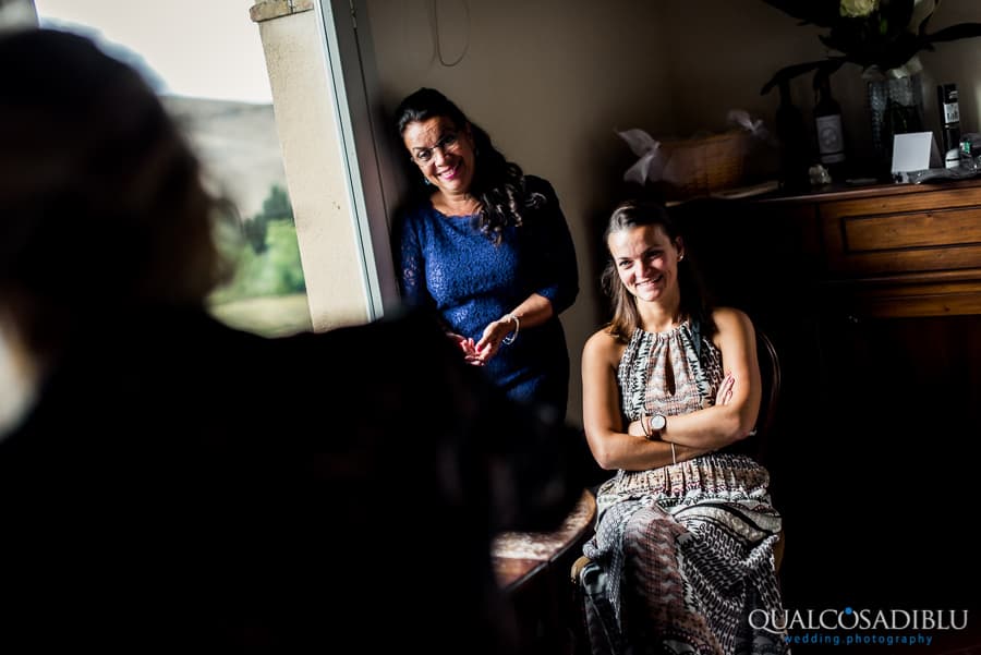 mother and sister of the bride smiling