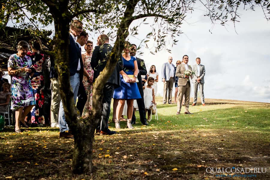 groom and the guests waiting for the bride