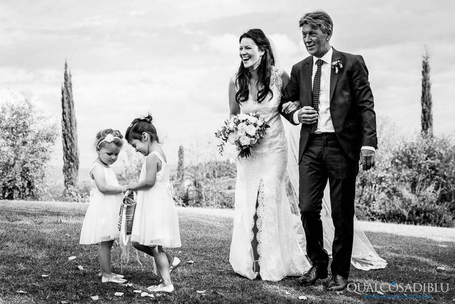 bride with father and ladies with flowers