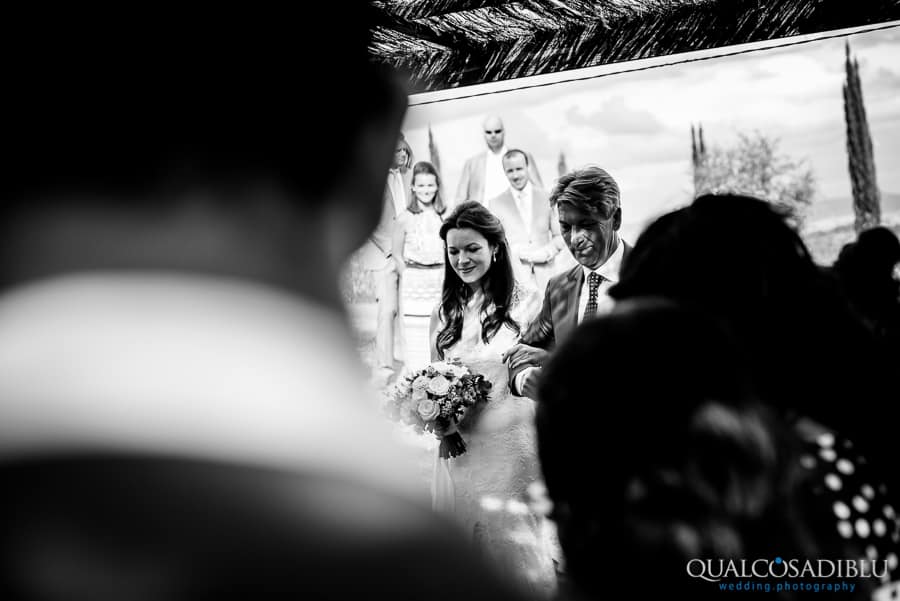 bride and father walking together on the aisle