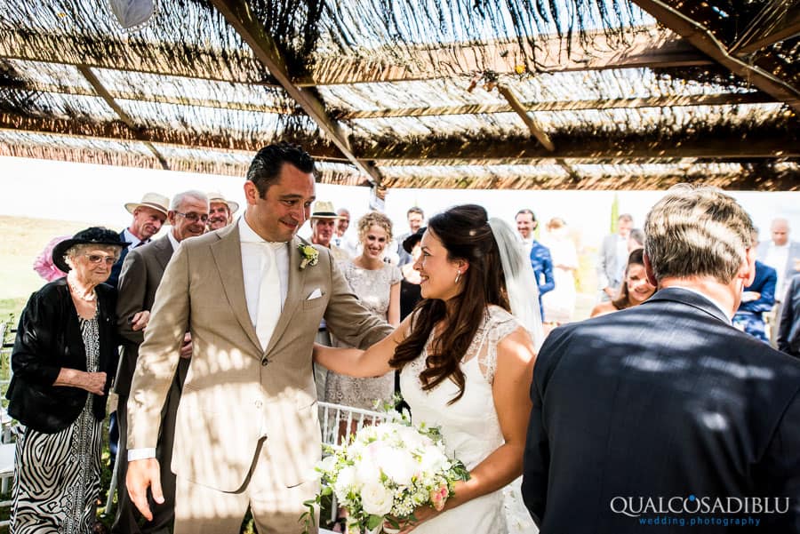 bride and groom smiling together ceremony