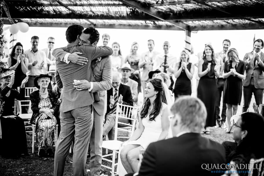 hug groom and his bestman