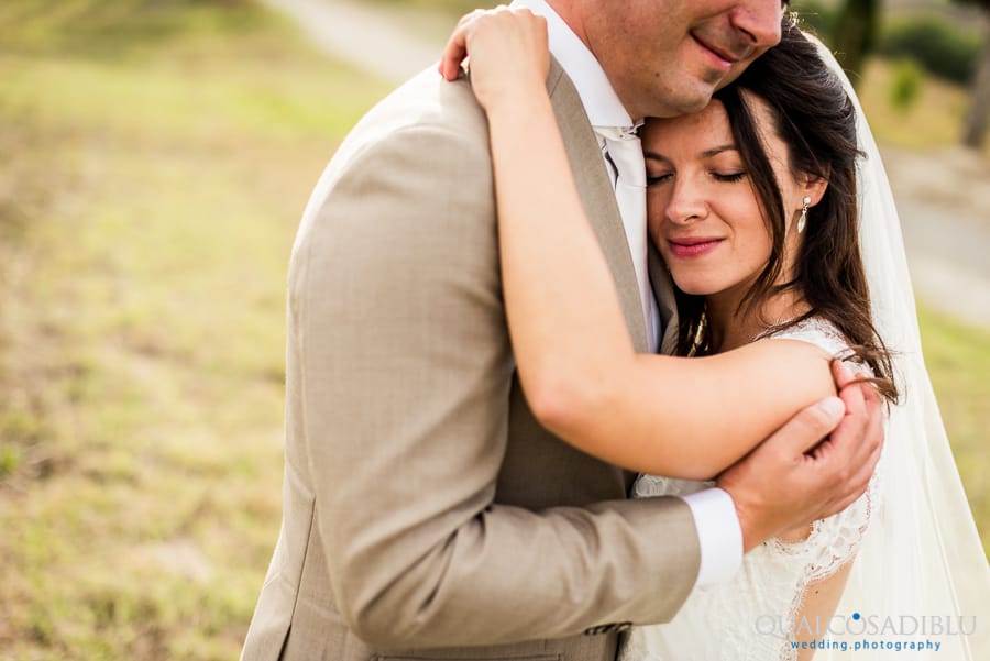 bride and groom embraced