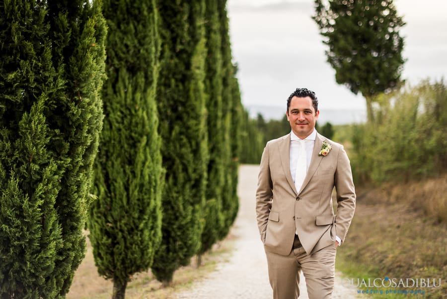 groom portrait tuscany cypresses