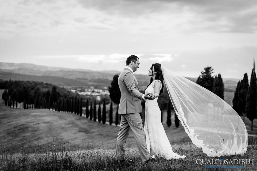 bride and groom holding their hands black and white