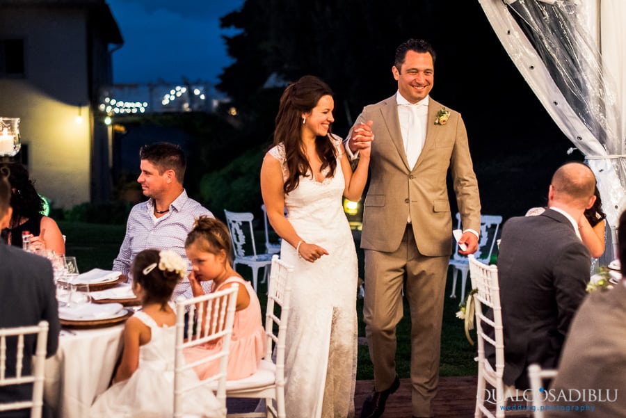 bride and groom arrive at main table