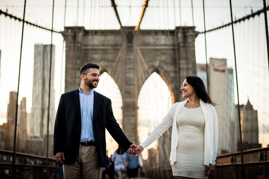 Lovely couple holdings their hands brooklyn bridge