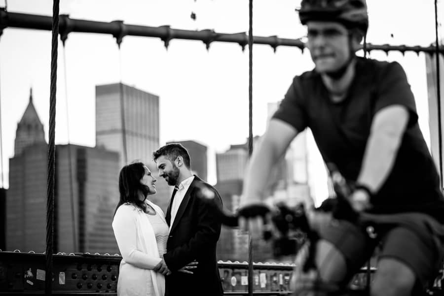 Engaged couple brooklyn bridge cyclist