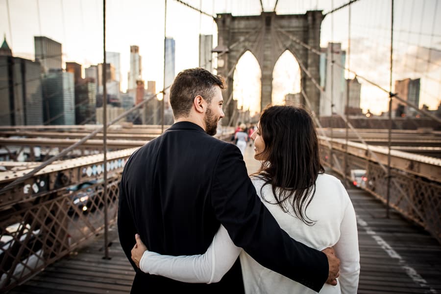 embraced couple in love brooklyn bridge