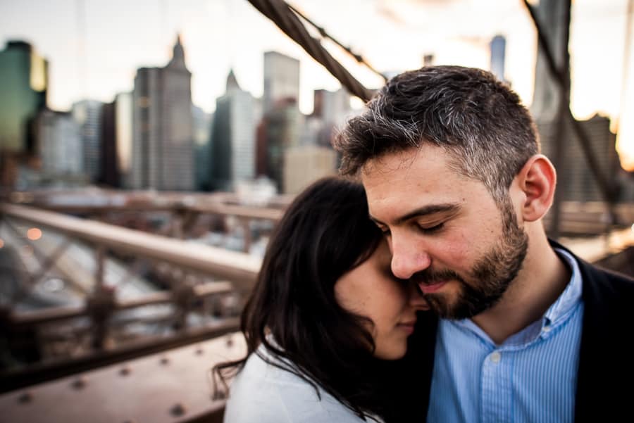 engaged couple love embrace new york background