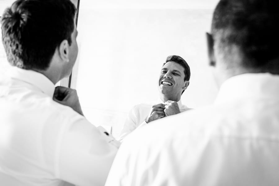 groom smiling getting ready