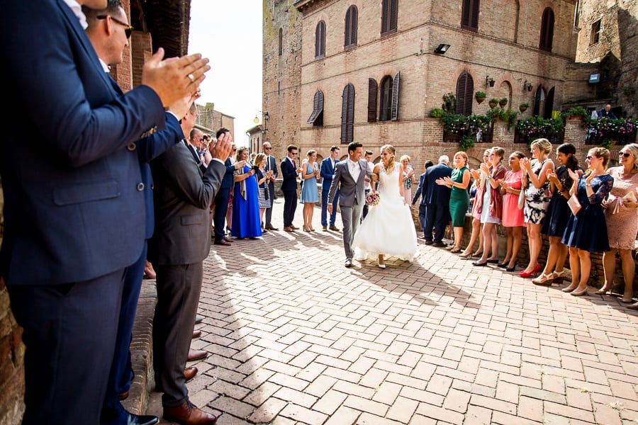 bride groom walking together with guests certaldo