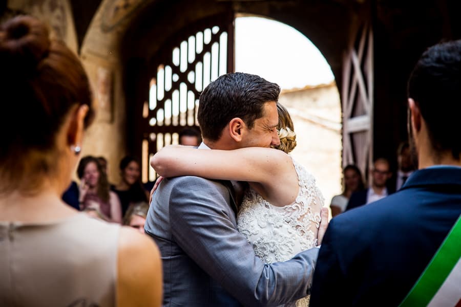 hug bride groom ceremony