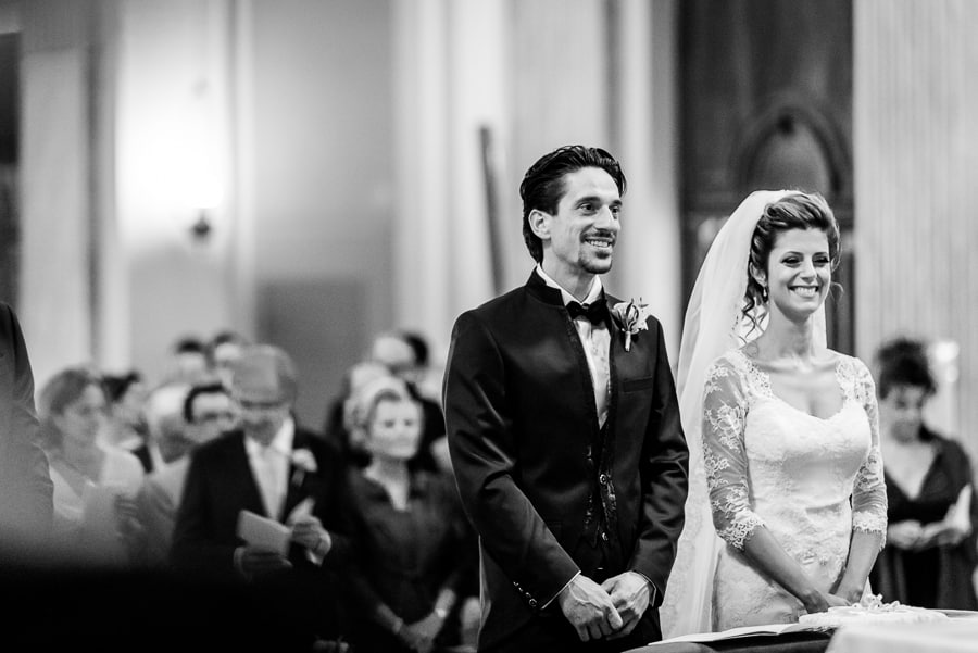 bride groom smiling church black and white