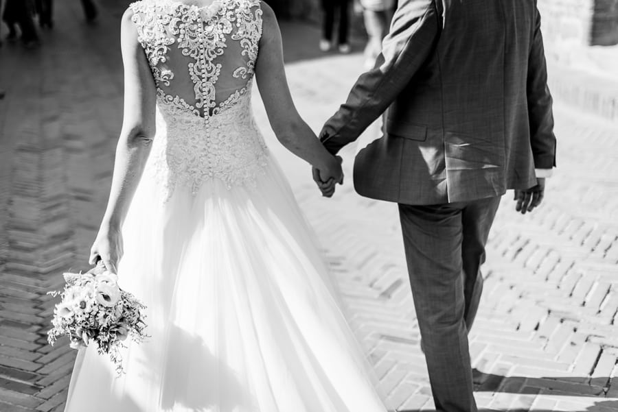 bride groom holding their hands certaldo black and white