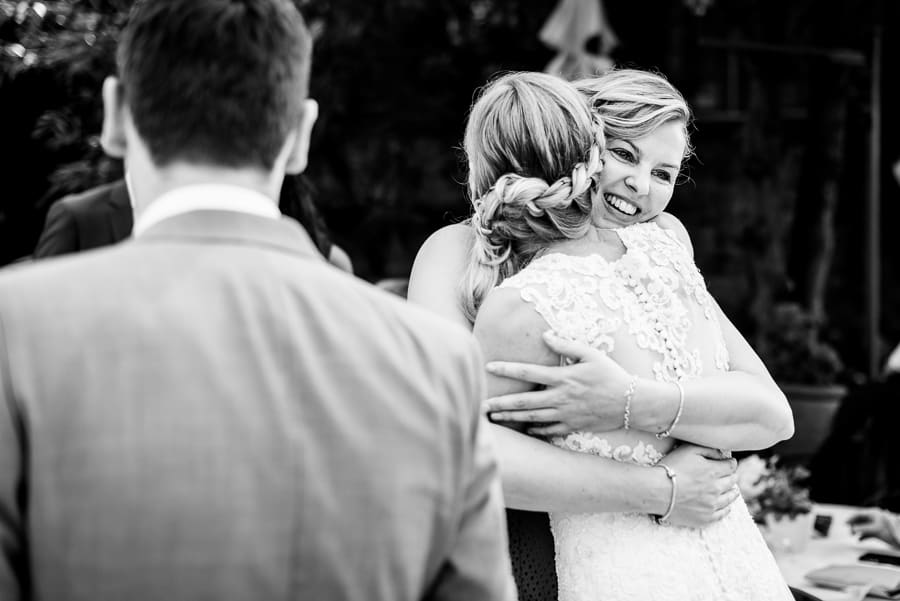 wedding guest smiling black and white