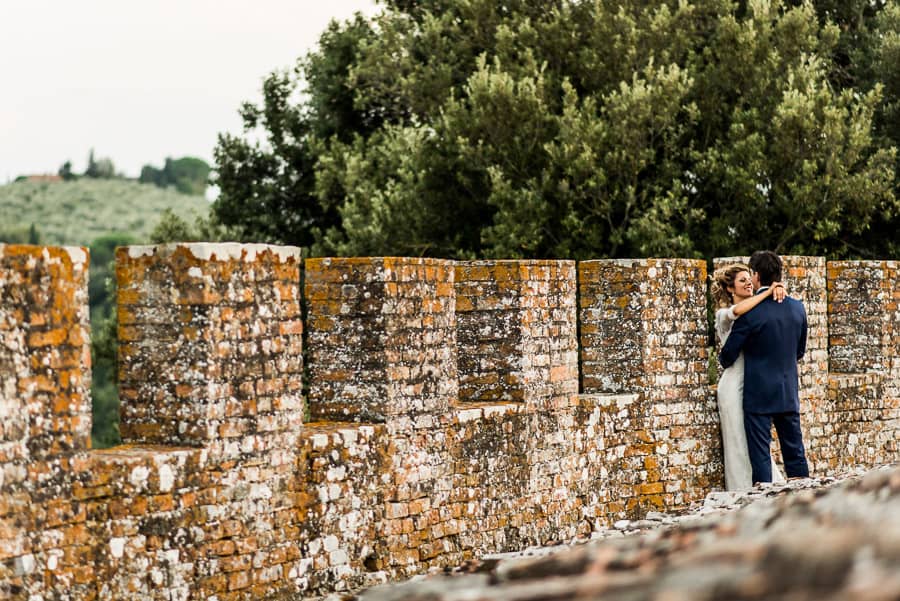 bride and groom embraced oliveto castle