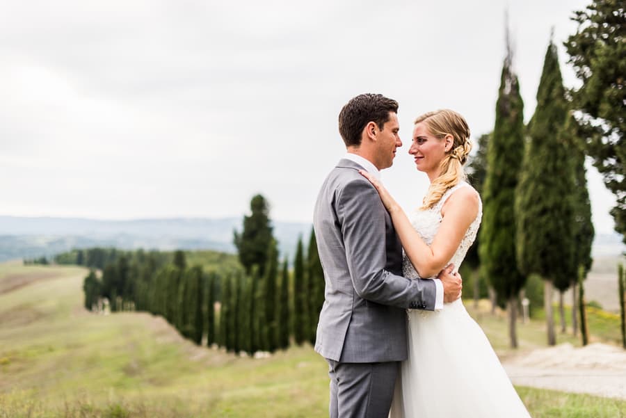 wedding couple tuscany cypresses backdrop