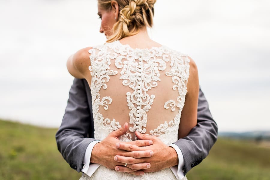 spouses hug detail hands