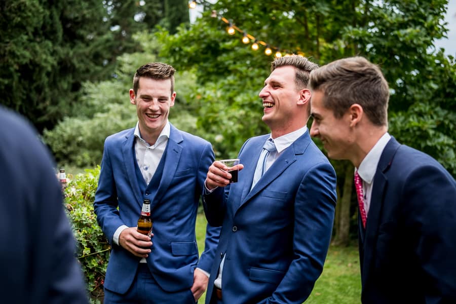 guests smiling drinking beer