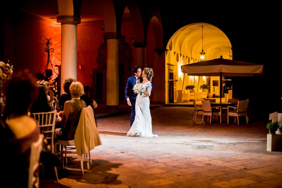 bride groom kissing dinner