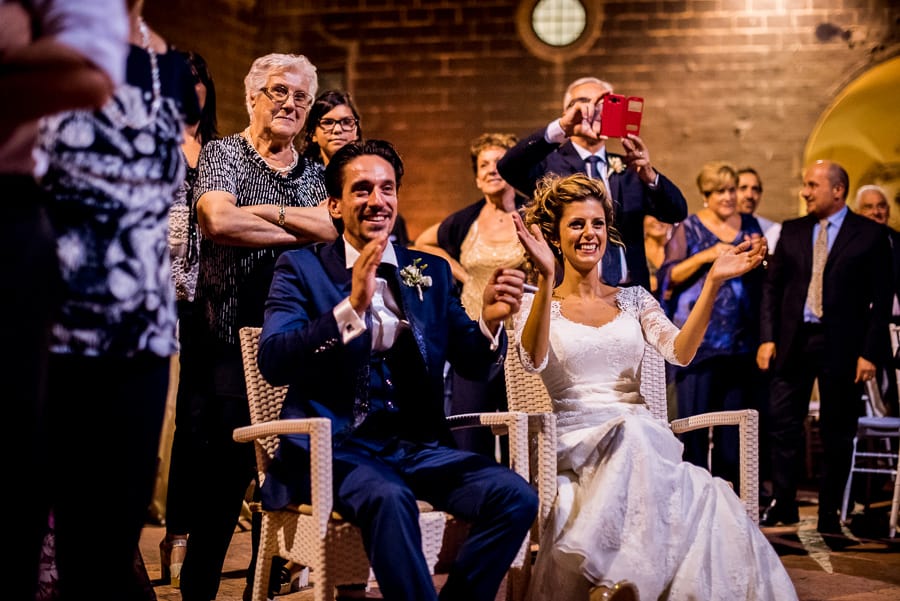 bride and groom clapping their hands