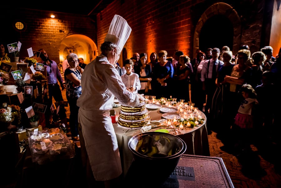 baker making wedding cake