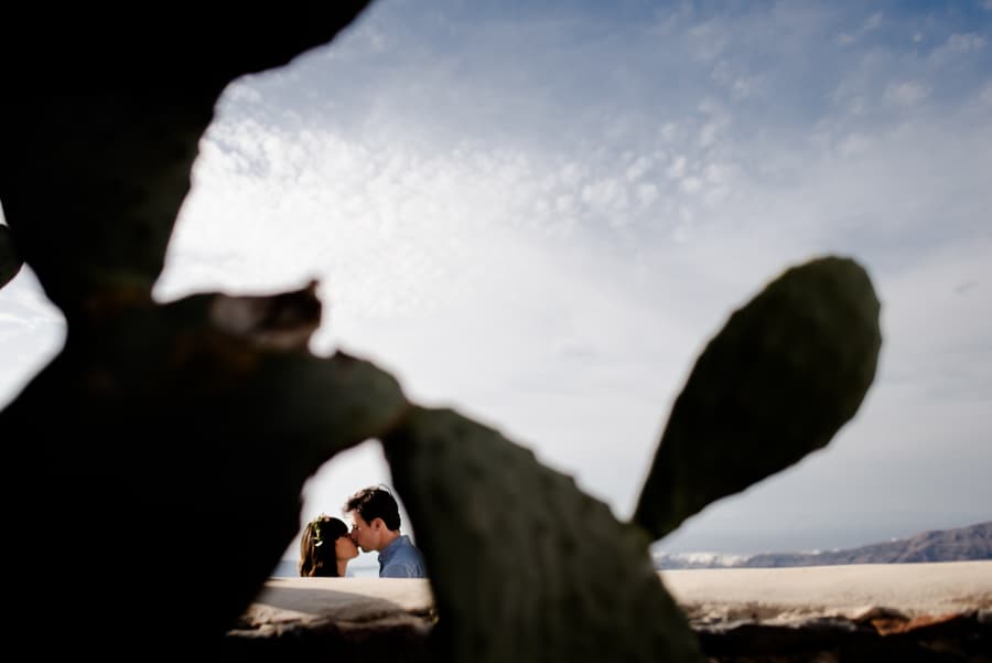 couple kissing at imerovigli santorini