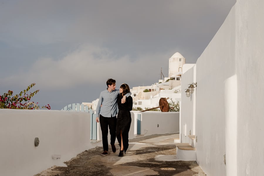 couple walking together santorini greece