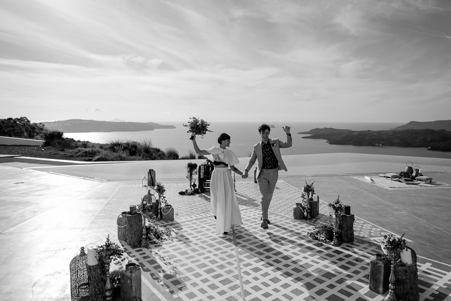 happy bride and groom exit from ceremony spot