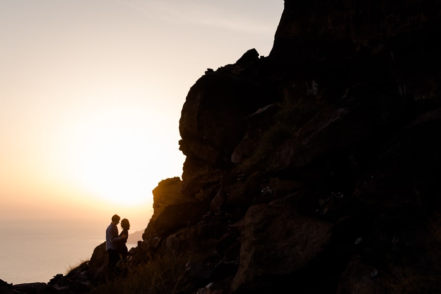 engagement sunset couple embraced skaros rock imerovigli santorini