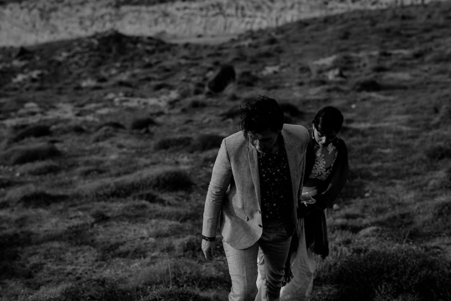 bride and groom walking together santorini