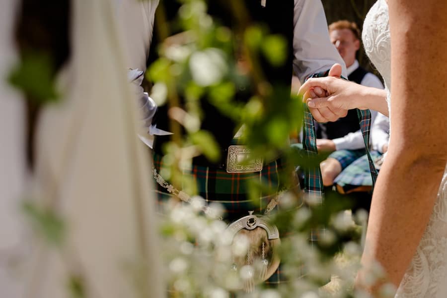 Bride and groom holdings their hands