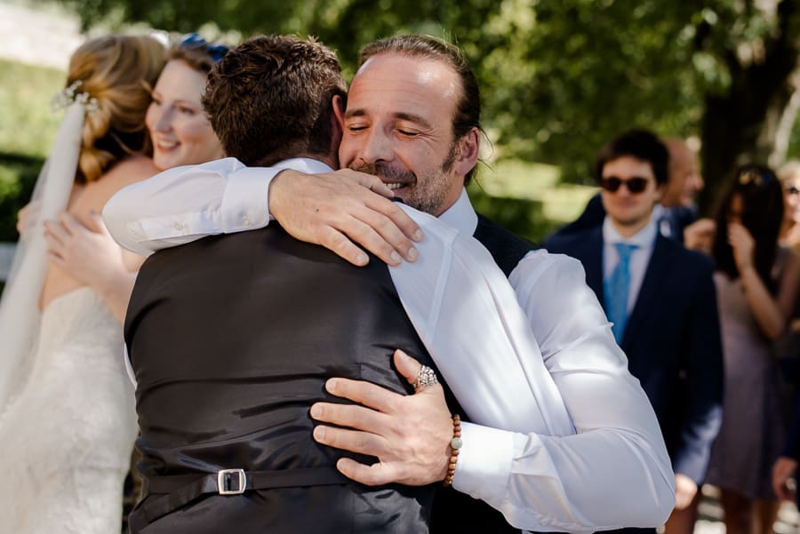 Best man hug the groom