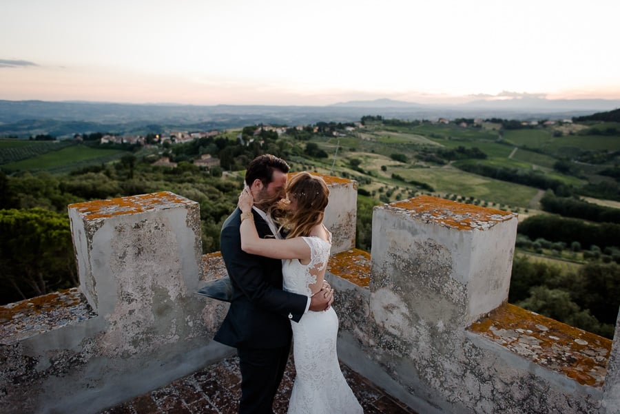couple embracing at the top of a medieval tower
