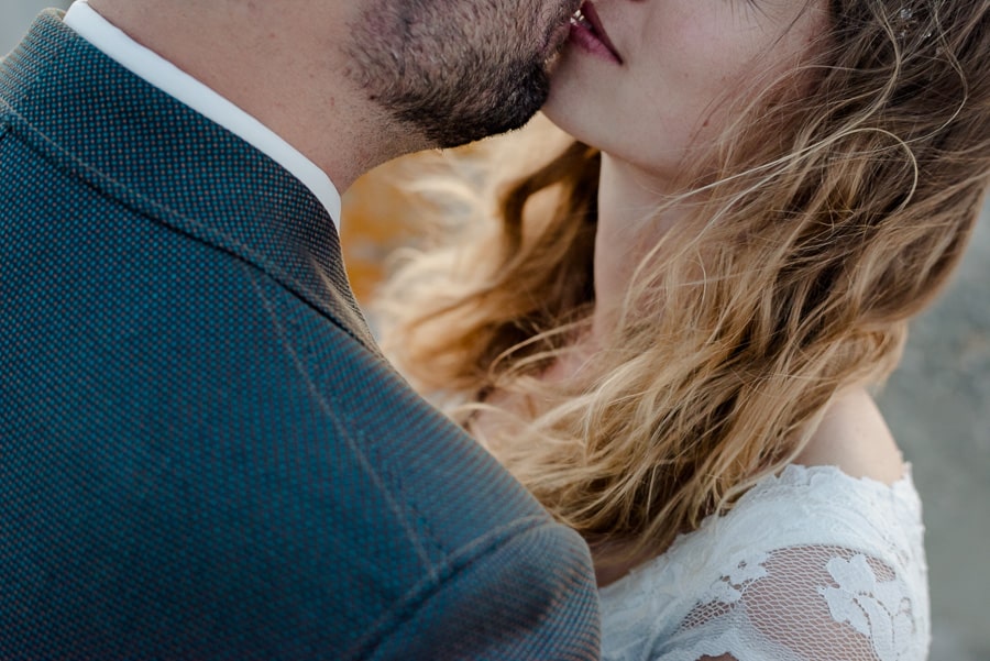 romantic kiss bride and groom