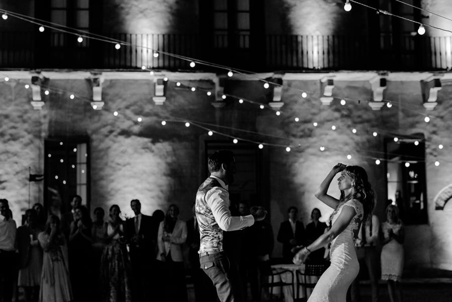 bride and groom dancing black and white