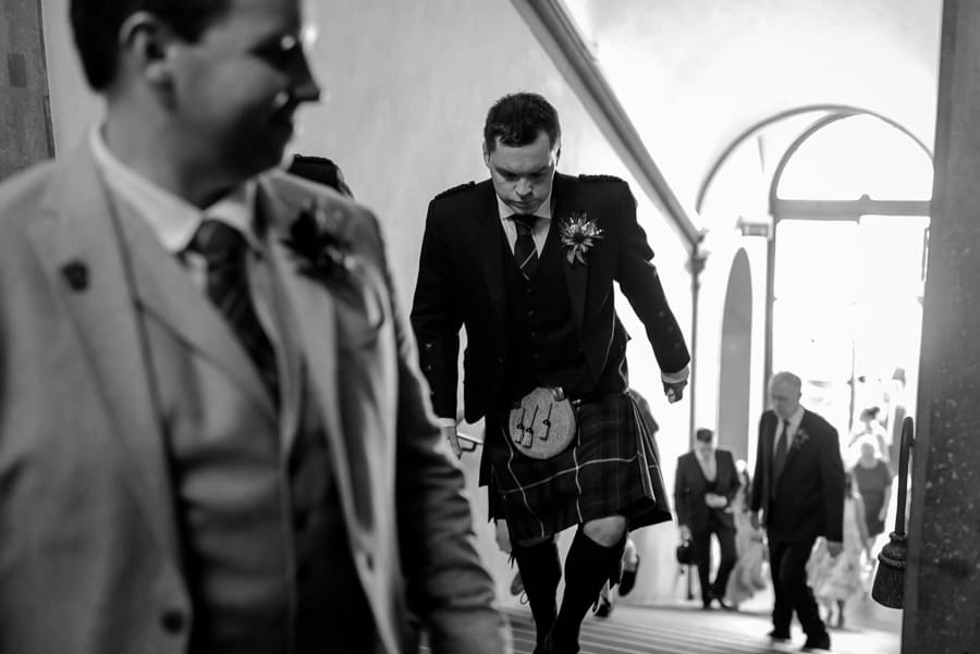 groom walking to the palazzo vecchio florence for wedding ceremony