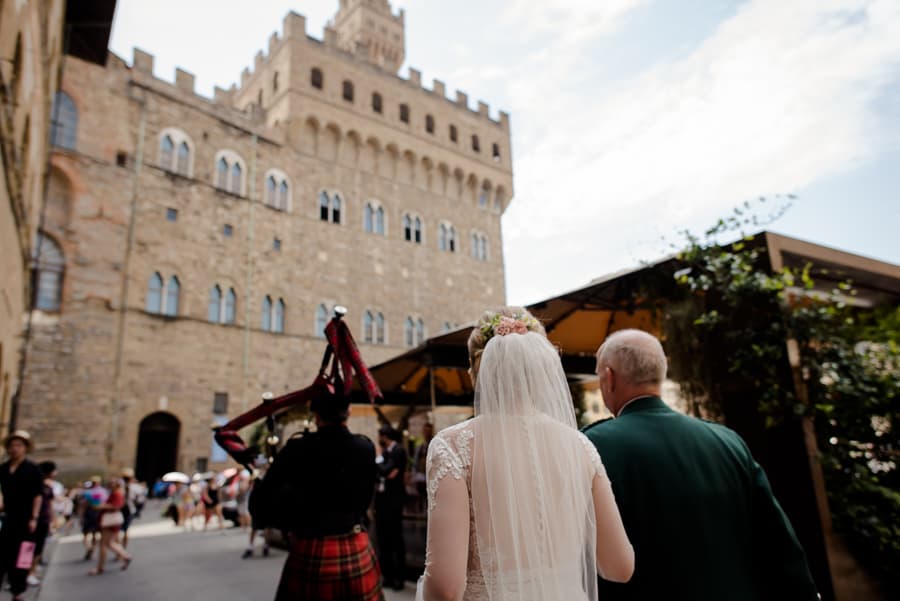 Bride walking to palazzo vecchio for ceremony