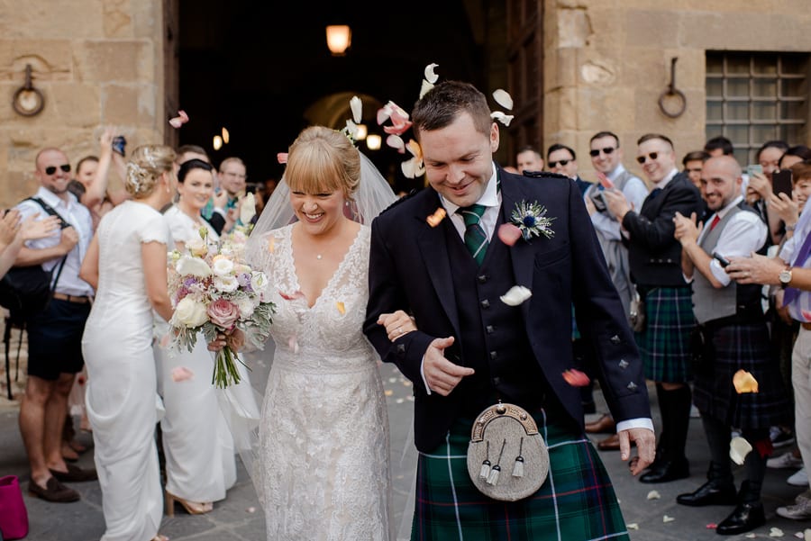 Bride and groom celebrate in florence with petals toss