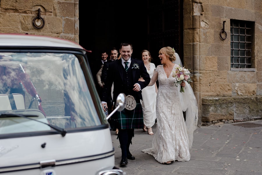 bride and groom walking to the ape calessino in florence