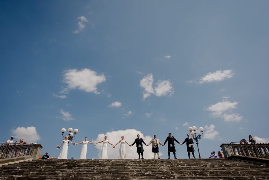 Group photo bridal party at piazzale michelangelo in Florence