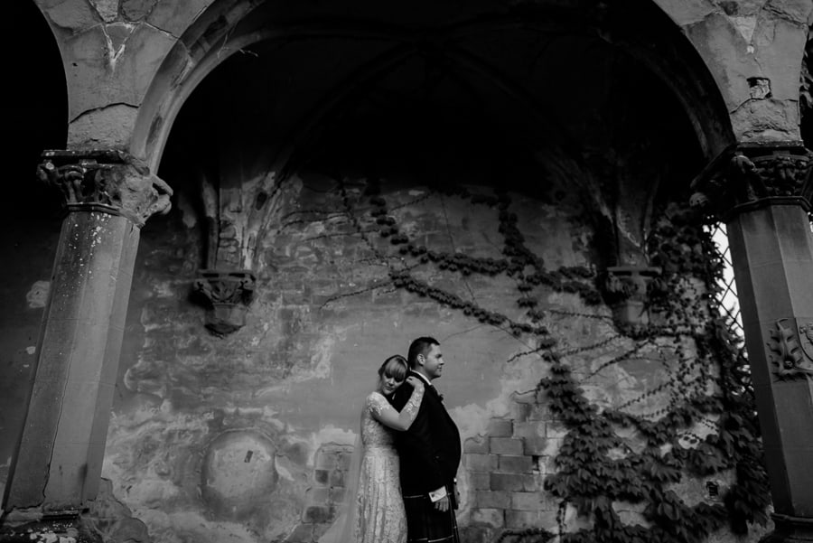 bride and groom intimate pose vincigliata castle black and white