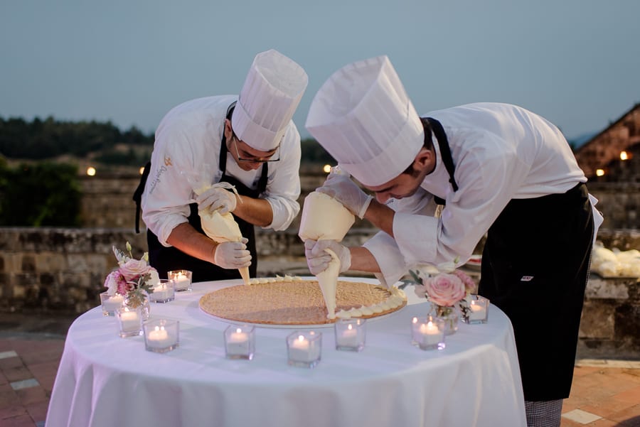 Bakers composing the wedding cake