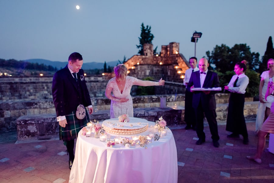 Bride and groom with the wedding cake