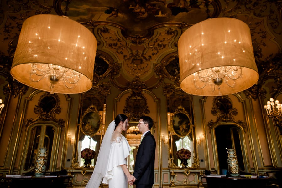 Bride and groom inside the mirror room