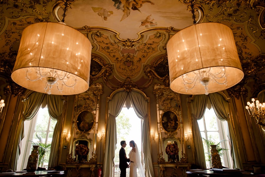 Bride and groom in the mirror room