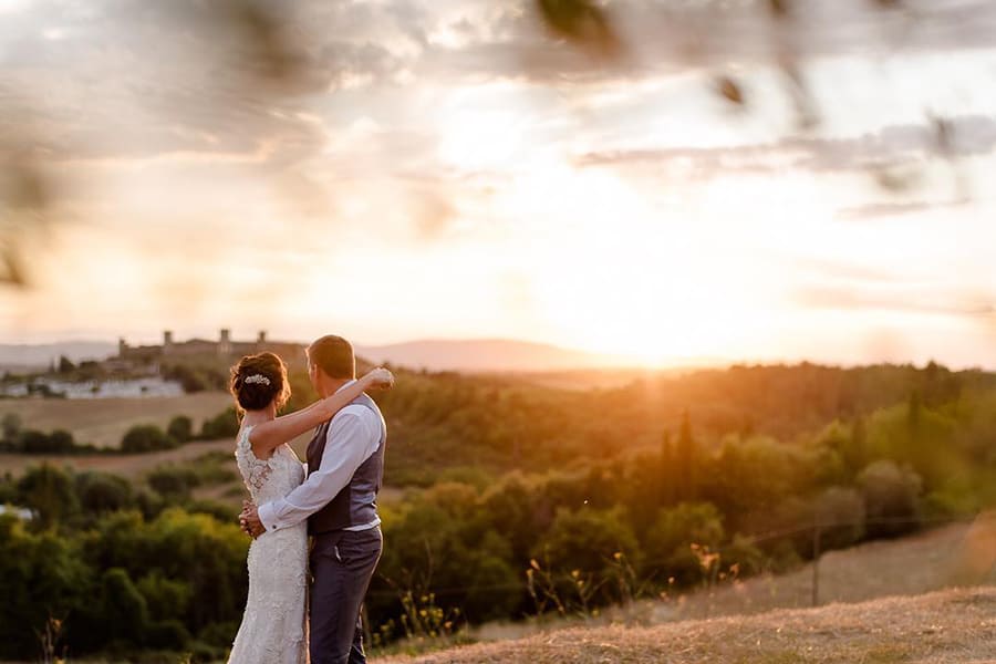 Tuscany Wedding Styling Ideas and Inspiration bride and groom to the sunset in a tuscany landscape