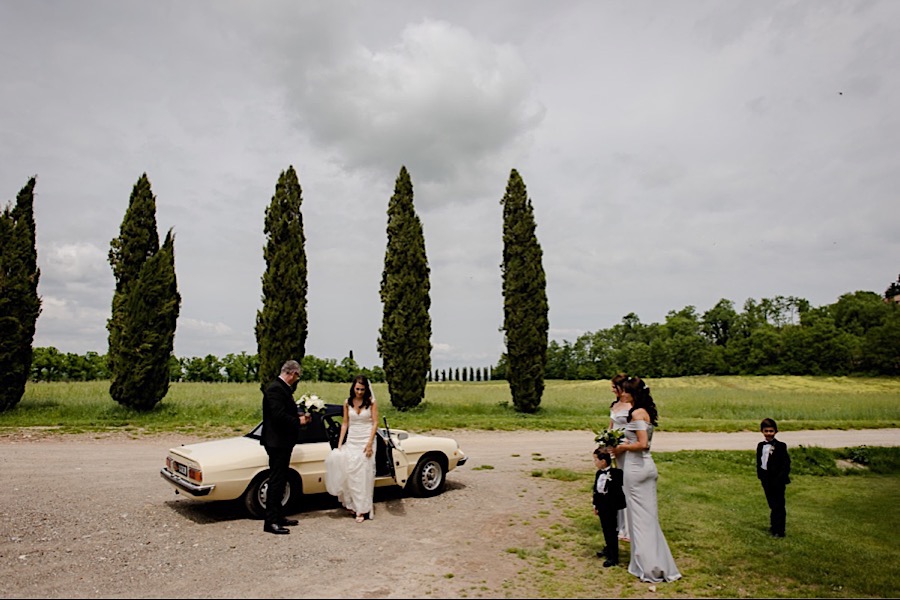 Bride arrival with father and bridesmaids at San Galgano abbey